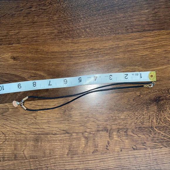 Black cord necklace with unique coral colored shell. - Picture 3 of 3